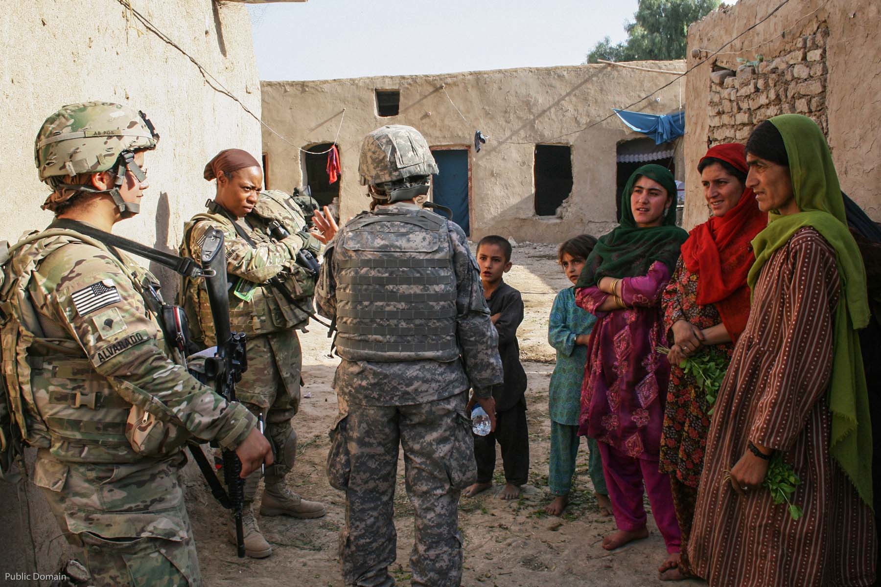 KANDAHAR CITY, Afghanistan (Aug. 4) – Spc. Christina Alvarado and Sgt. Shanequa Cardona, members of the Female Engagement Team with Headquarters and Headquarters Company, 2nd Battalion, 8th Infantry Regiment, 2nd Brigade Combat Team, 4th Infantry Division, talk to some local women with the help of their interpreter Hayda Azizi, in sub district 6, Aug. 4. “The women have a lot of concerns about their children’s education and medical needs,” Alvarado said.  (U.S. Army photo by Sgt. Ruth Pagan, 2nd Brigade Combat Team, 4th Infantry Division PAO)